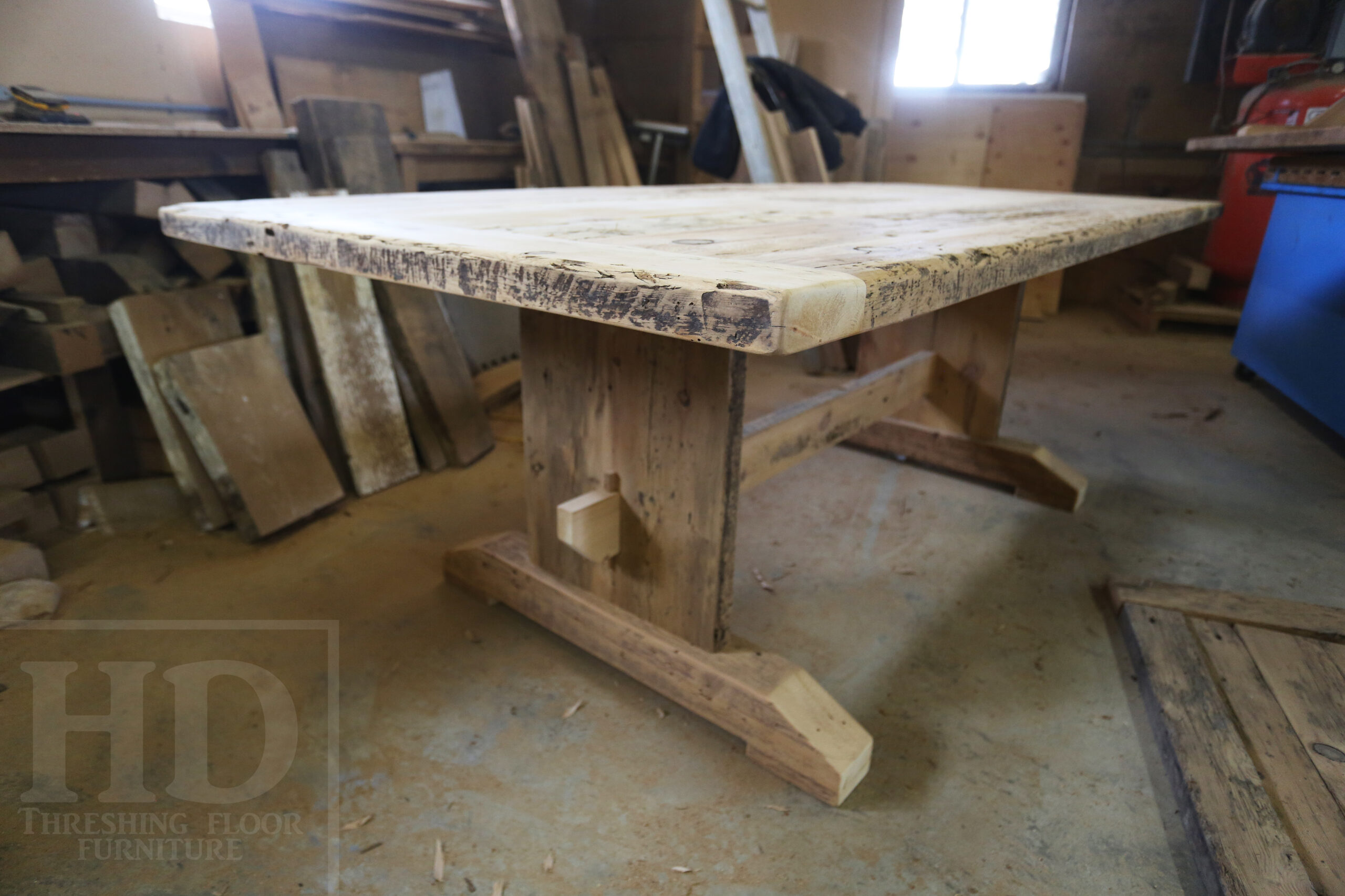 7' Ontario Barnwood Table for a Grassie, Ontario Home - 42" wide - Trestle Base - Reclaimed Old Growth Pine Threshing Floor Construction - Original Distressing & Character & Edges Maintained - Premium epoxy + satin polyurethane finish - One 18" Leaf Extension - 7' [matching] Trestle Bench - 5 Wormy Maple Chairs - Stained to match table - www.table.ca